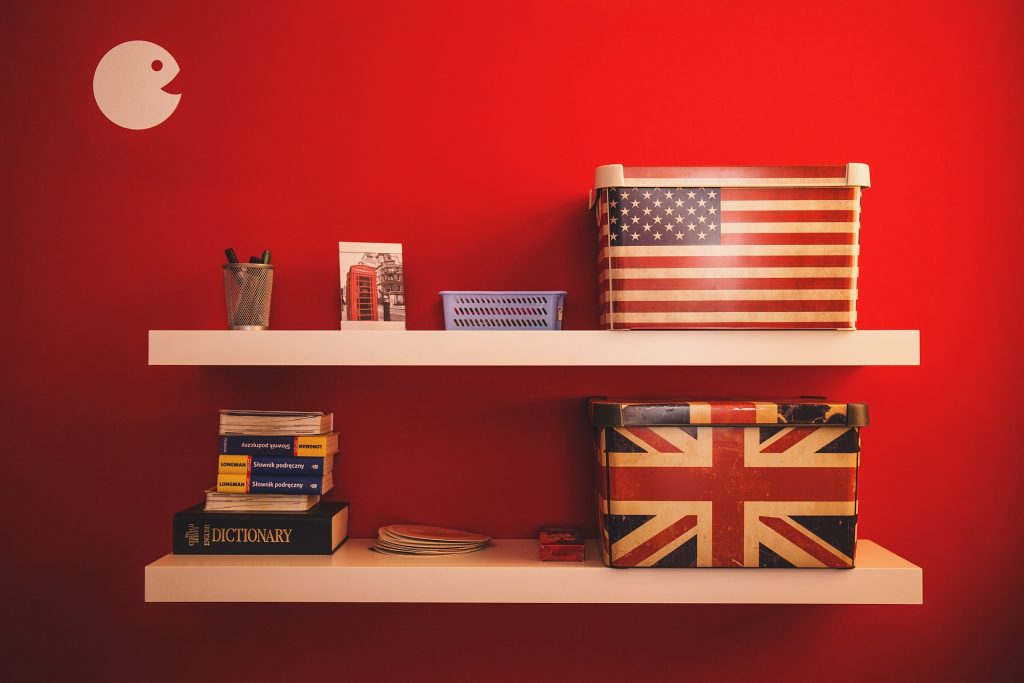 shelves with boxes printed American and English flag